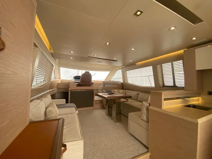 Soulshine Yacht Photos Pics Luxurious interior of 2017 Beneteau Monte Carlo MC6 yacht with modern furnishings and ambient lighting.
