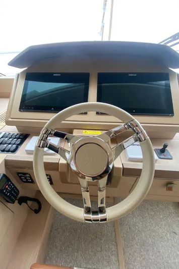 Soulshine Yacht Photos Pics Steering wheel and dual screens of 2017 Beneteau Monte Carlo MC6 yacht cockpit.
