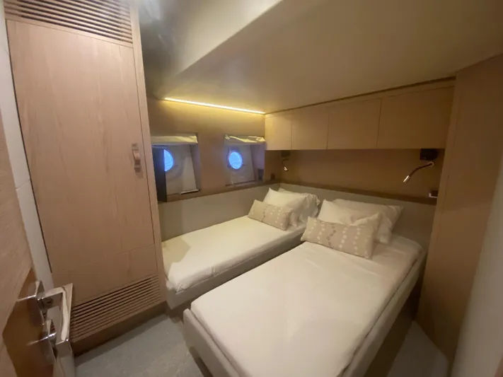 Soulshine Yacht Photos Pics 2017 Beneteau Monte Carlo MC6 cabin with twin beds and modern wood finish.