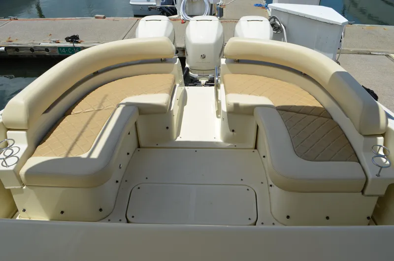  Yacht Photos Pics 2016 Chris-Craft Launch 36 boat with beige seating, docked at a marina.