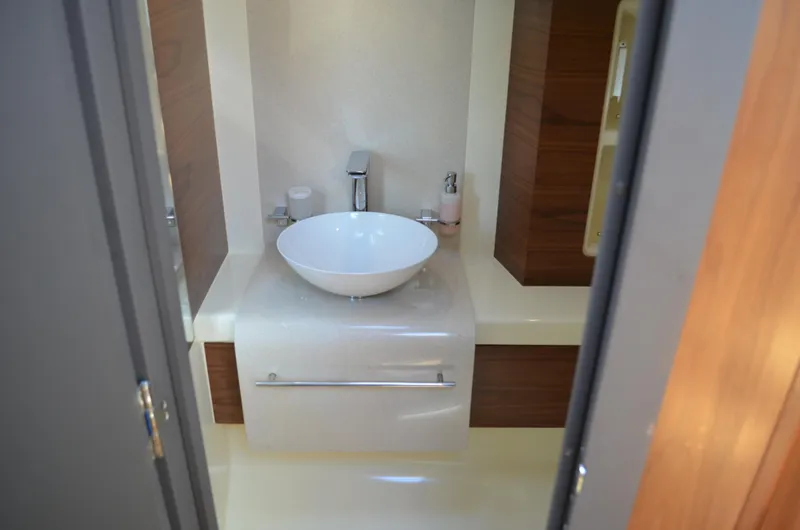  Yacht Photos Pics 2016 Chris-Craft Launch 36 bathroom with modern sink and sleek design.
