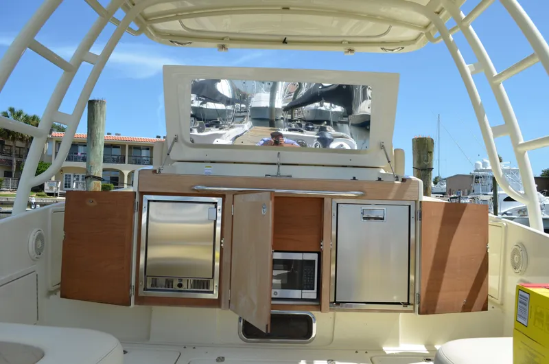  Yacht Photos Pics 2016 Chris-Craft Launch 36 boat interior with open cabinets and appliances.