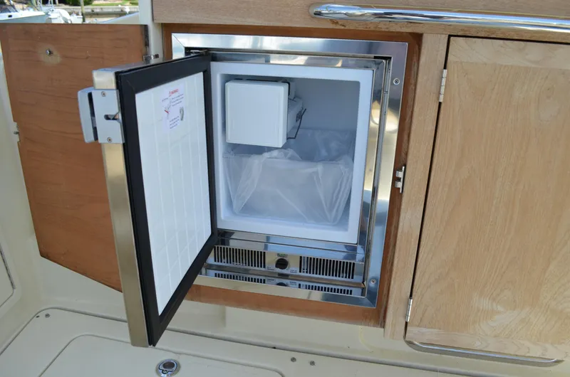  Yacht Photos Pics 2016 Chris-Craft Launch 36 boat interior with open mini fridge.