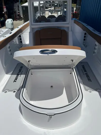  Yacht Photos Pics 2023 Twin Vee 340 GFX boat with open storage compartment.