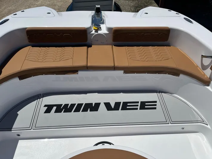  Yacht Photos Pics 2023 Twin Vee 340 GFX boat with tan seating and branded flooring.
