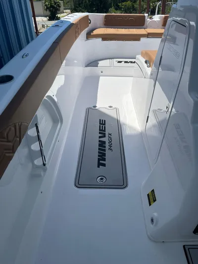  Yacht Photos Pics 2023 Twin Vee 340 GFX boat interior with seating and branding.