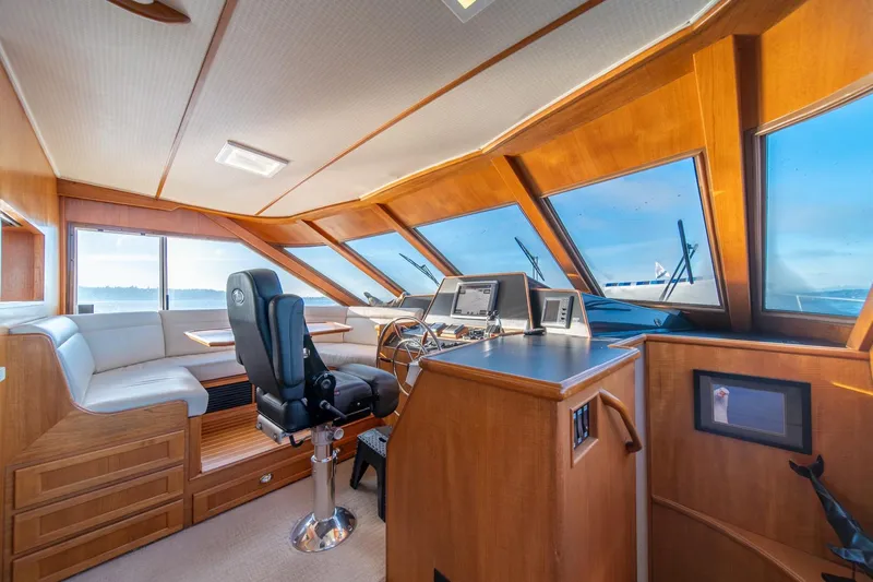 Sumo Yacht Photos Pics Luxurious 1991 Tollycraft 57 Pilothouse Motor Yacht interior with panoramic windows and modern helm.