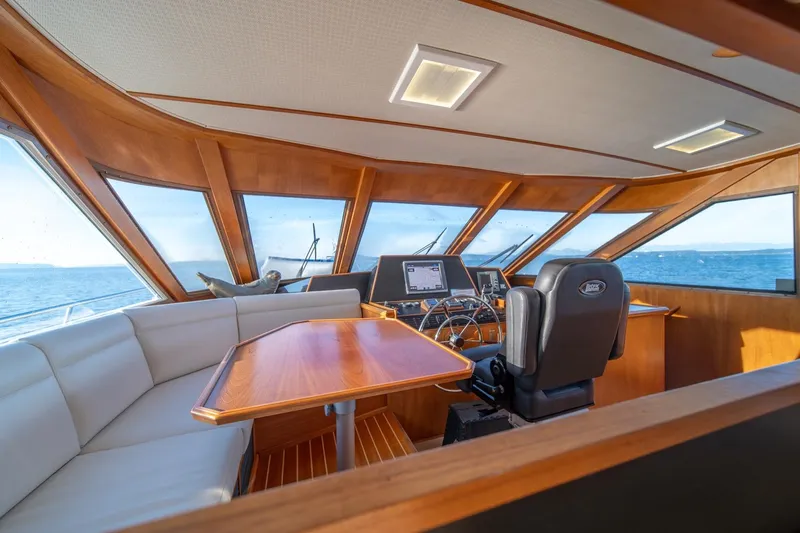 Sumo Yacht Photos Pics Luxurious 1991 Tollycraft 57 Pilothouse Motor Yacht interior with panoramic ocean views.