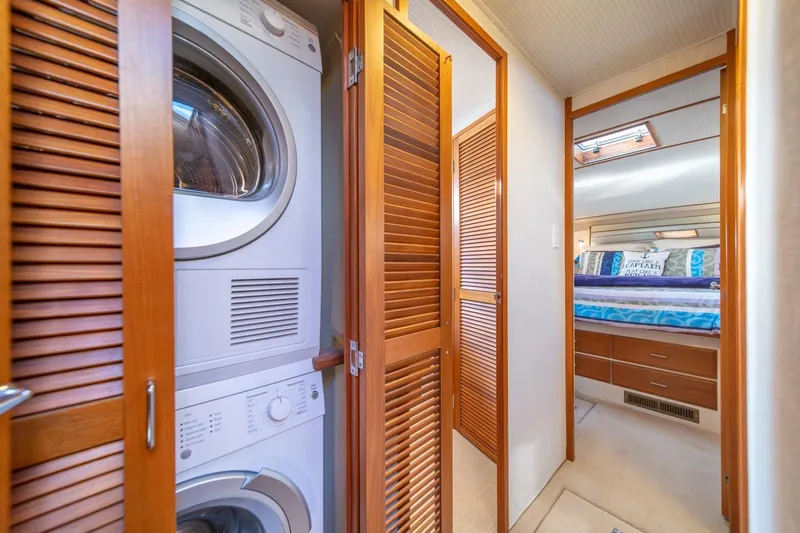 Sumo Yacht Photos Pics Laundry area and bedroom in 1991 Tollycraft 57 Pilothouse Motor Yacht.