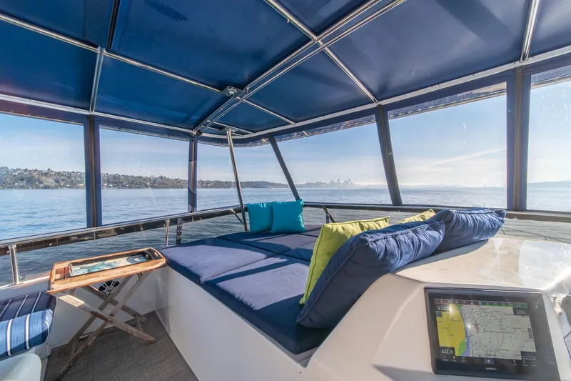 Sumo Yacht Photos Pics Luxurious 1991 Tollycraft 57 Pilothouse Motor Yacht interior with scenic ocean view.