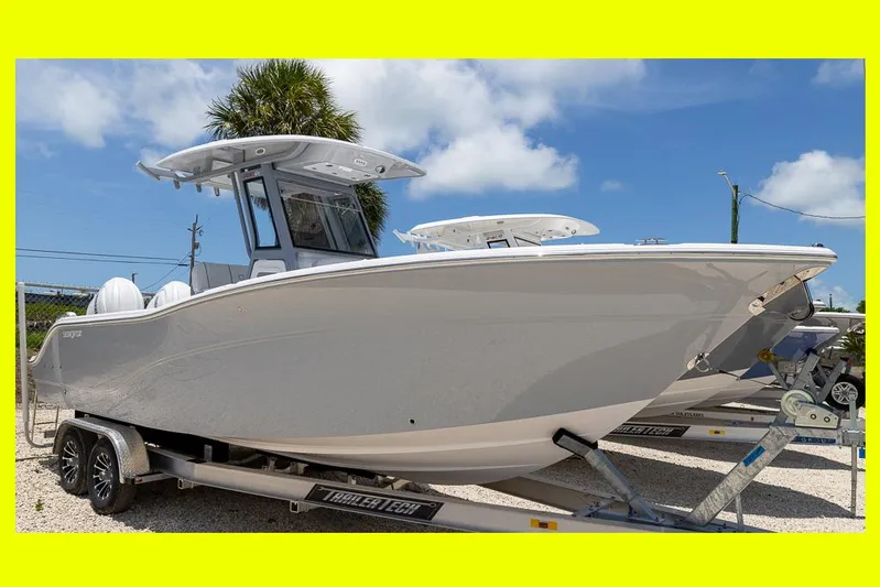  Yacht Photos Pics 2026 Sea Fox 268 Commander boat on trailer under blue sky.