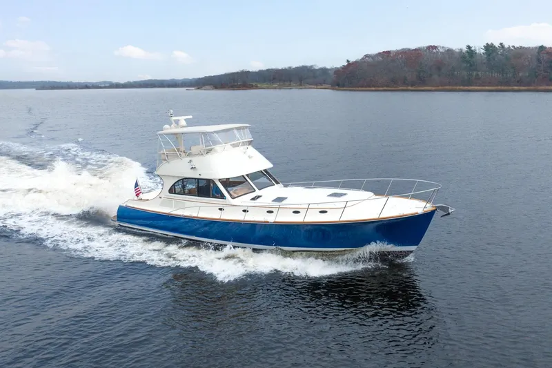Sapphire II Yacht Photos Pics 2006 Hinckley Talaria 55 FB yacht cruising on a calm lake.