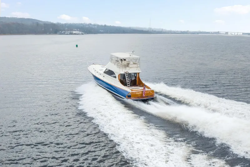 Sapphire II Yacht Photos Pics 2006 Hinckley Talaria 55 FB yacht cruising on open water.