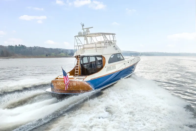 Sapphire II Yacht Photos Pics 2006 Hinckley Talaria 55 FB yacht cruising on open water.