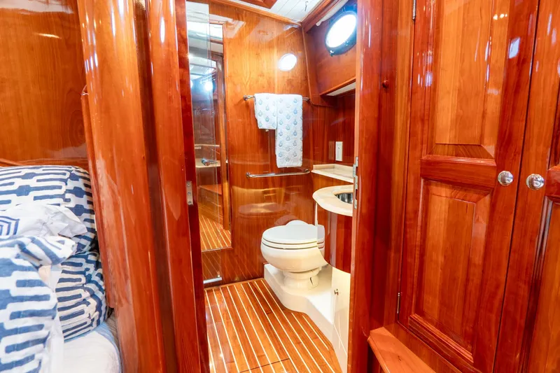 Sapphire II Yacht Photos Pics Luxurious wooden bathroom interior of 2006 Hinckley Talaria 55 FB yacht.
