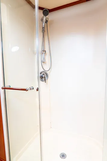 Sapphire II Yacht Photos Pics 2006 Hinckley Talaria 55 FB yacht shower with glass door and chrome fixtures.