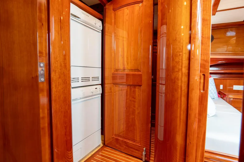 Sapphire II Yacht Photos Pics Hinckley Talaria 55 FB 2006 yacht interior with wooden cabinetry and built-in appliances.