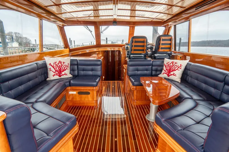 Sapphire II Yacht Photos Pics Luxurious interior of 2006 Hinckley Talaria 55 FB yacht with elegant wood and leather seating.