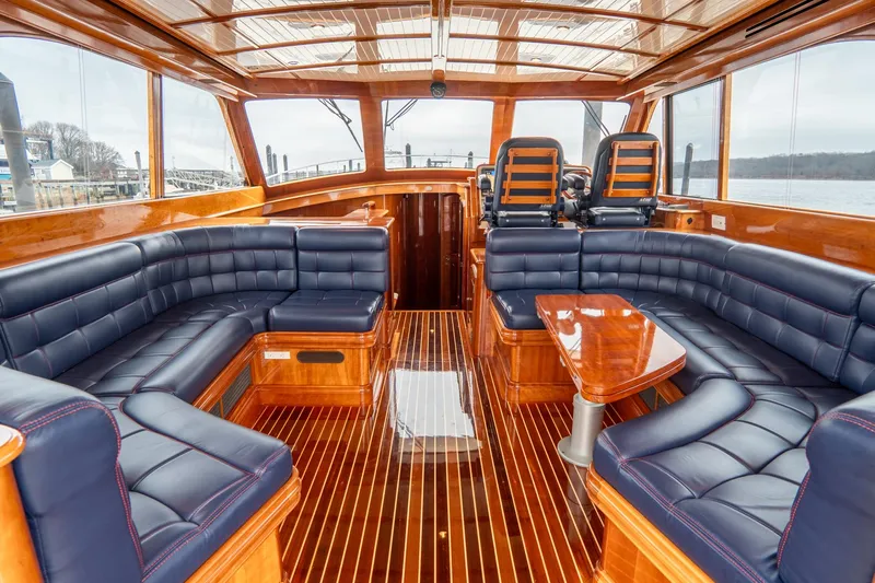 Sapphire II Yacht Photos Pics Luxurious interior of 2006 Hinckley Talaria 55 FB yacht with elegant wood and leather seating.