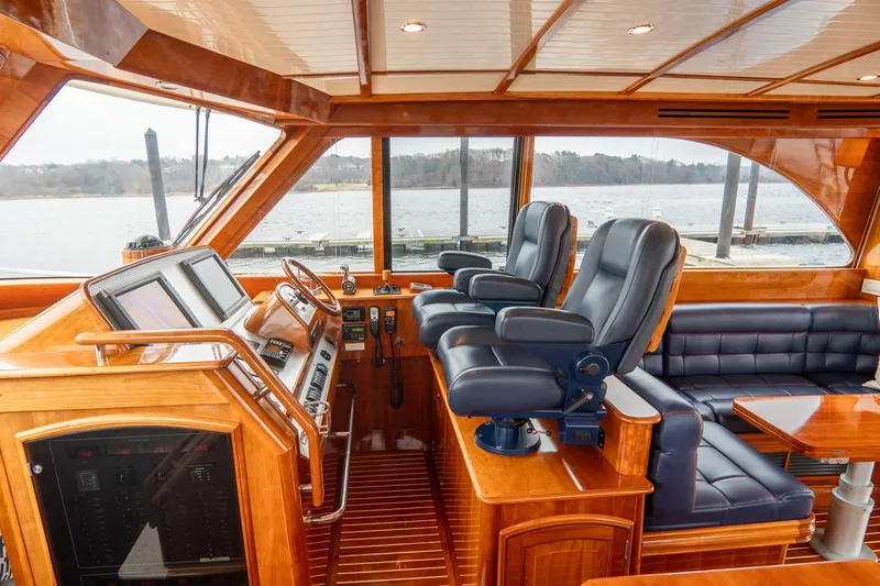 Sapphire II Yacht Photos Pics Luxurious 2006 Hinckley Talaria 55 FB yacht interior with leather seating and wooden finishes.