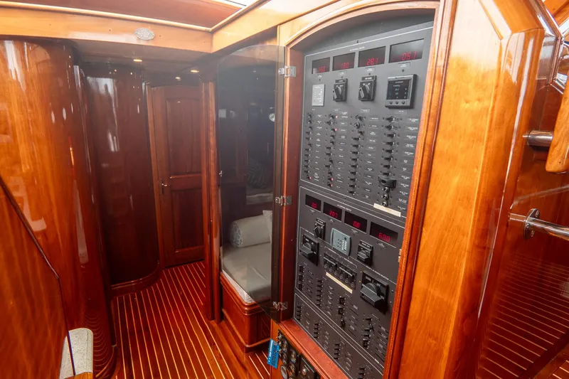 Sapphire II Yacht Photos Pics Hinckley Talaria 55 FB 2006 yacht interior with wooden paneling and control panel.