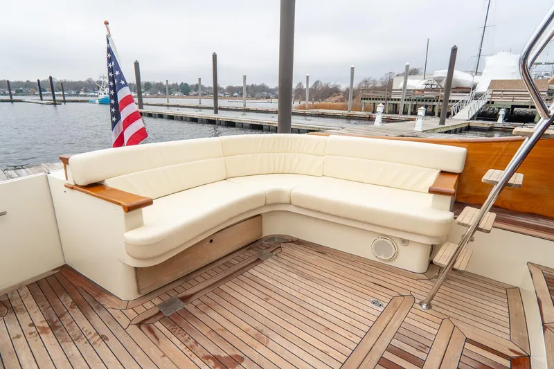 Sapphire II Yacht Photos Pics Hinckley Talaria 55 FB 2006 yacht deck with seating and American flag.