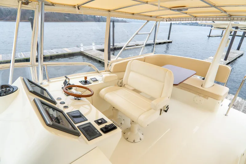 Sapphire II Yacht Photos Pics 2006 Hinckley Talaria 55 FB yacht helm with luxurious seating and navigation controls.