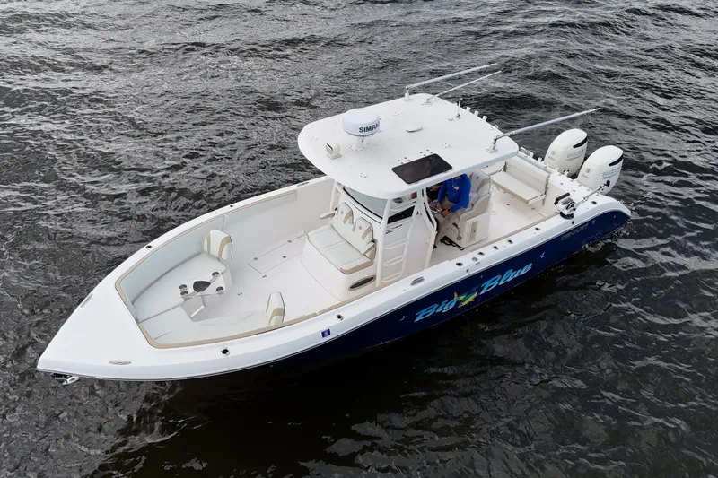 Big Blue Yacht Photos Pics 2017 Century 3200 Center Console boat on water, featuring dual engines and spacious deck.