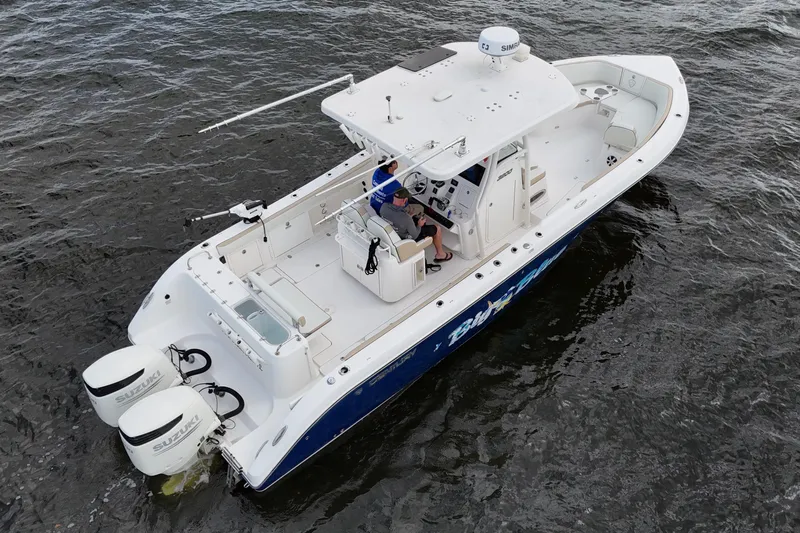 Big Blue Yacht Photos Pics 2017 Century 3200 Center Console boat on water, featuring dual Suzuki engines.