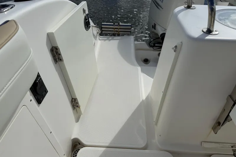 Big Blue Yacht Photos Pics 2017 Century 3200 Center Console boat interior with storage compartments and seating.
