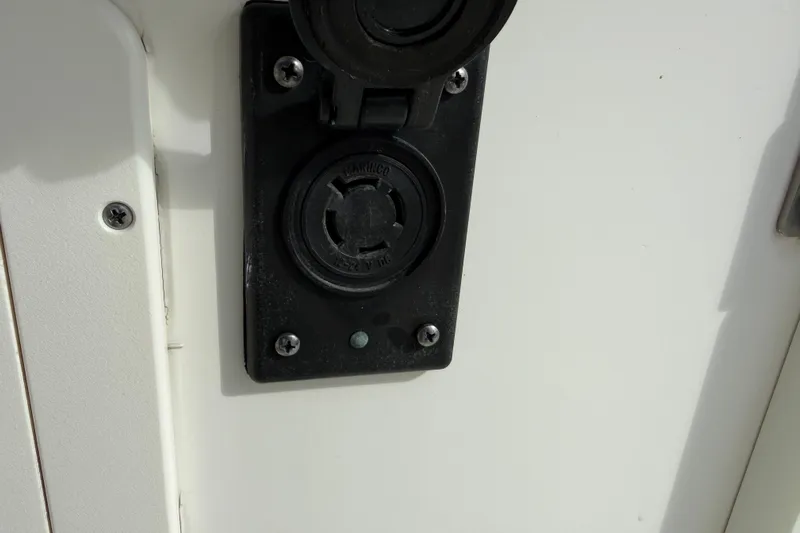 Big Blue Yacht Photos Pics Power outlet on 2017 Century 3200 Center Console boat, close-up view.