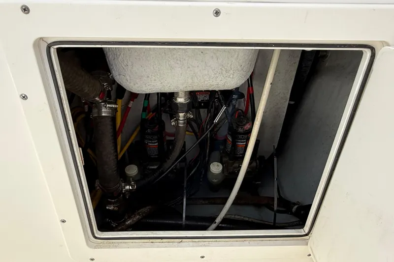 Big Blue Yacht Photos Pics Access hatch of a 2017 Century 3200 Center Console boat showing internal components.