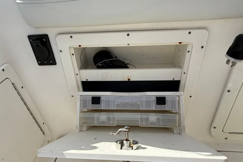 Big Blue Yacht Photos Pics Storage compartment on a 2017 Century 3200 Center Console boat with tackle box.