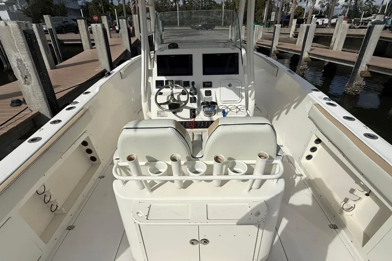 Big Blue Yacht Photos Pics 2017 Century 3200 Center Console boat interior with helm and seating at dock.