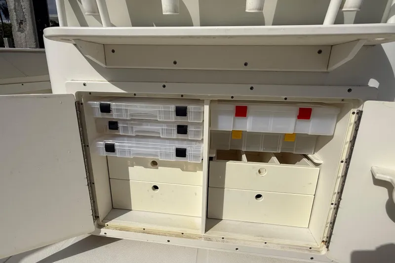 Big Blue Yacht Photos Pics Storage compartments on a 2017 Century 3200 Center Console boat, featuring organized tackle boxes.
