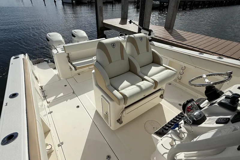 Big Blue Yacht Photos Pics 2017 Century 3200 Center Console boat interior with dual seats and steering wheel.