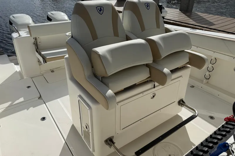 Big Blue Yacht Photos Pics 2017 Century 3200 Center Console boat with dual cushioned seats and storage.