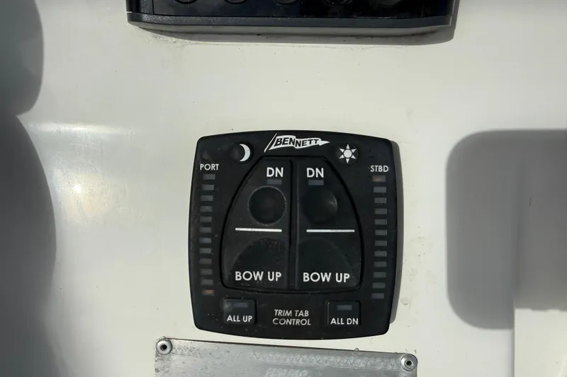 Big Blue Yacht Photos Pics Control panel of a 2017 Century 3200 Center Console boat with trim tab controls.