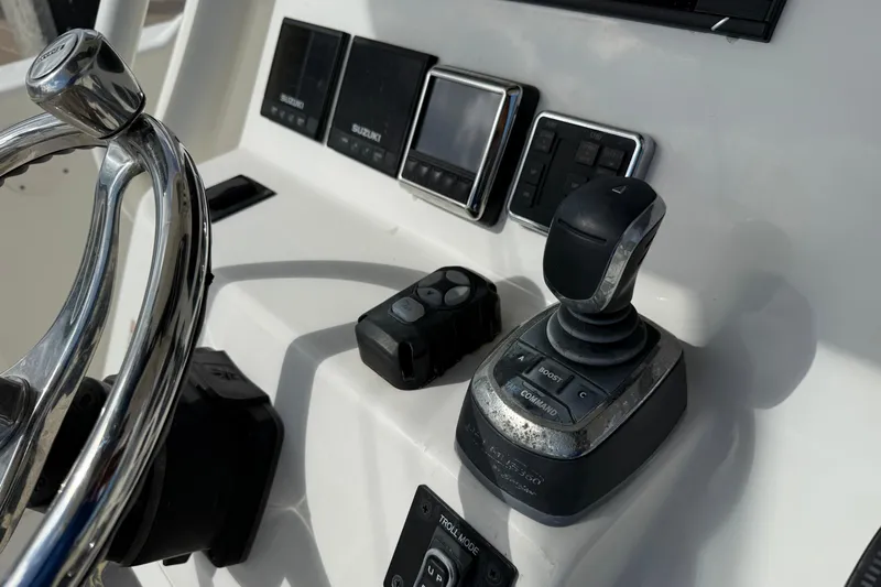 Big Blue Yacht Photos Pics Century 3200 Center Console 2017 boat dashboard with steering wheel and control panel.