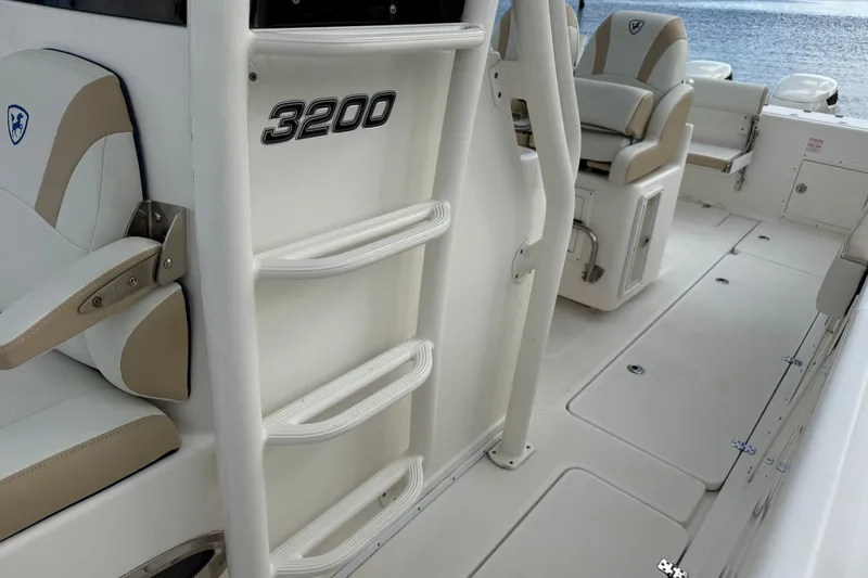 Big Blue Yacht Photos Pics 2017 Century 3200 Center Console boat interior with seating and ladder.