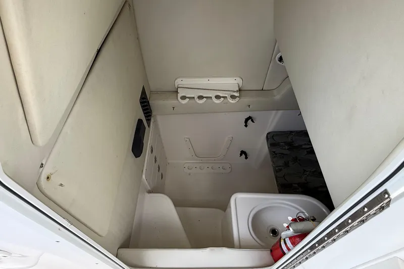 Big Blue Yacht Photos Pics Interior cabin of 2017 Century 3200 Center Console boat with sink and fire extinguisher.