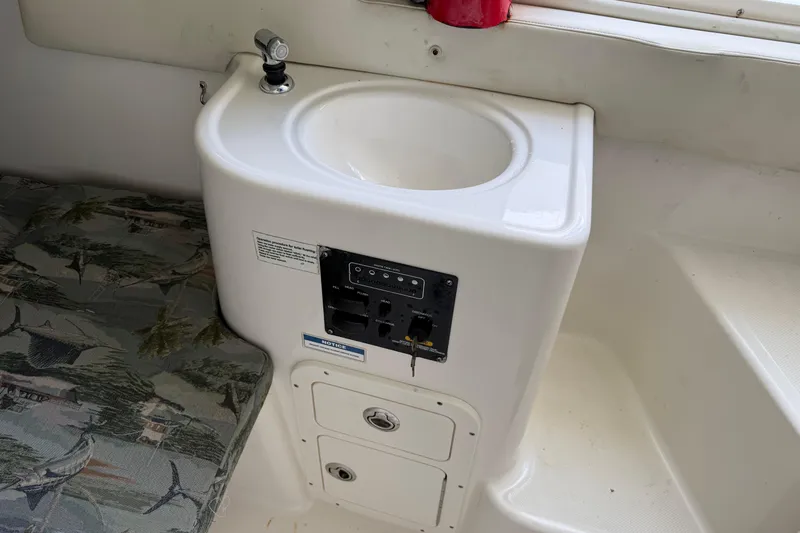 Big Blue Yacht Photos Pics 2017 Century 3200 Center Console boat interior with sink and control panel.