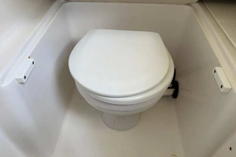Big Blue Yacht Photos Pics Toilet in 2017 Century 3200 Center Console boat's compact bathroom area.