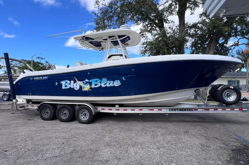 Big Blue Yacht Photos Pics 2017 Century 3200 Center Console boat on trailer, labeled "Big Blue," under clear sky.