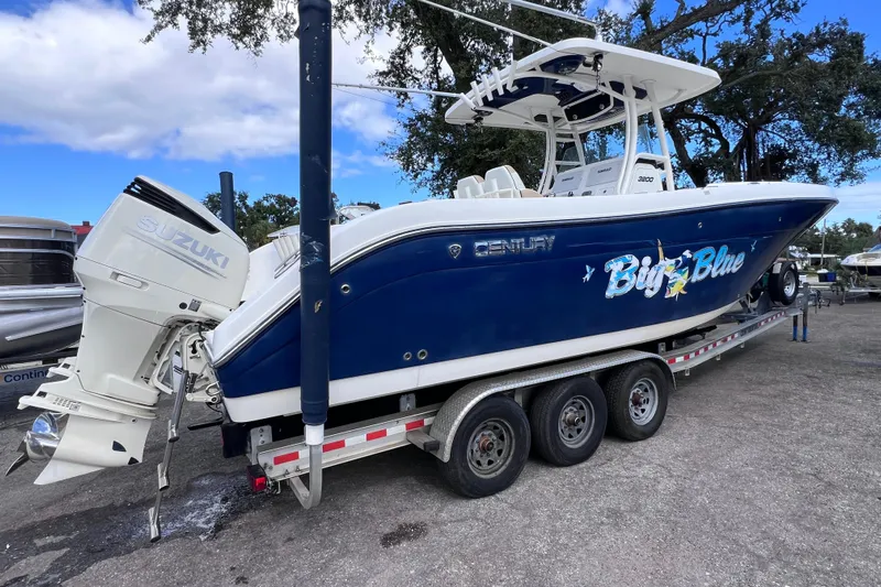 Big Blue Yacht Photos Pics 2017 Century 3200 Center Console boat on trailer with Suzuki outboard motor.