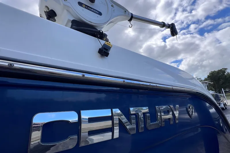 Big Blue Yacht Photos Pics 2017 Century 3200 Center Console boat with Cannon equipment under cloudy sky.