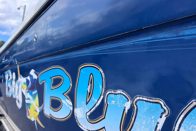 Big Blue Yacht Photos Pics 2017 Century 3200 Center Console boat with "Big Blue" decal on blue hull.