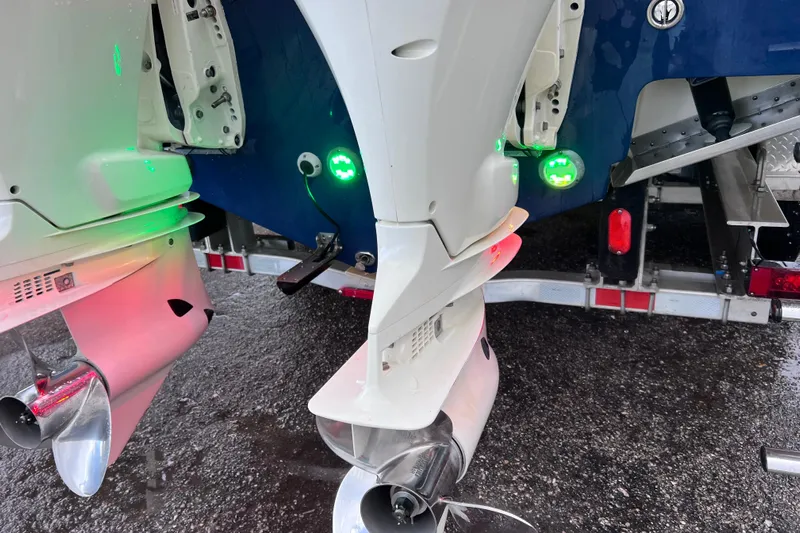 Big Blue Yacht Photos Pics 2017 Century 3200 Center Console boat with dual outboard motors and green LED lights.