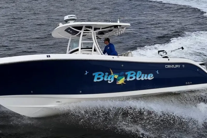 Big Blue Yacht Photos Pics 2017 Century 3200 Center Console boat named "Big Blue" cruising on the water.