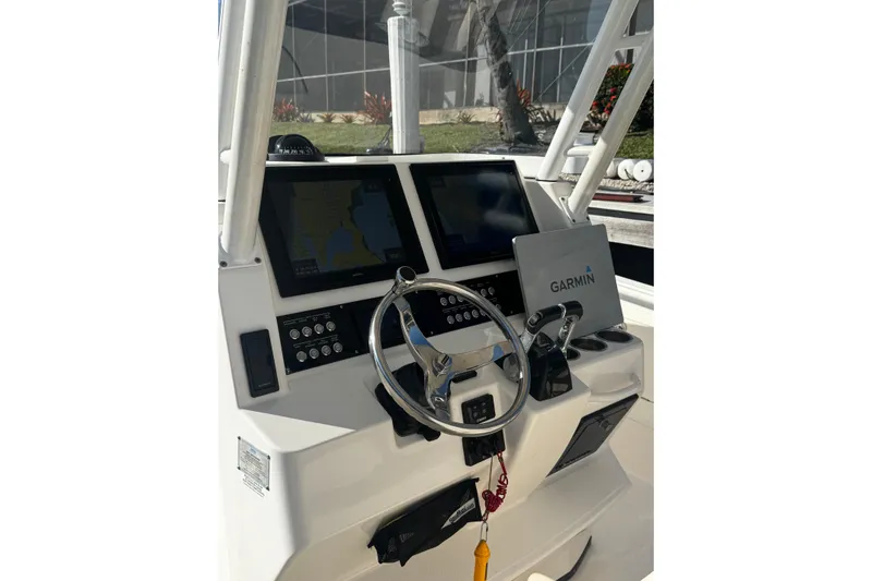  Yacht Photos Pics Edgewater 320CC 2015 boat dashboard with Garmin navigation system and dual displays.